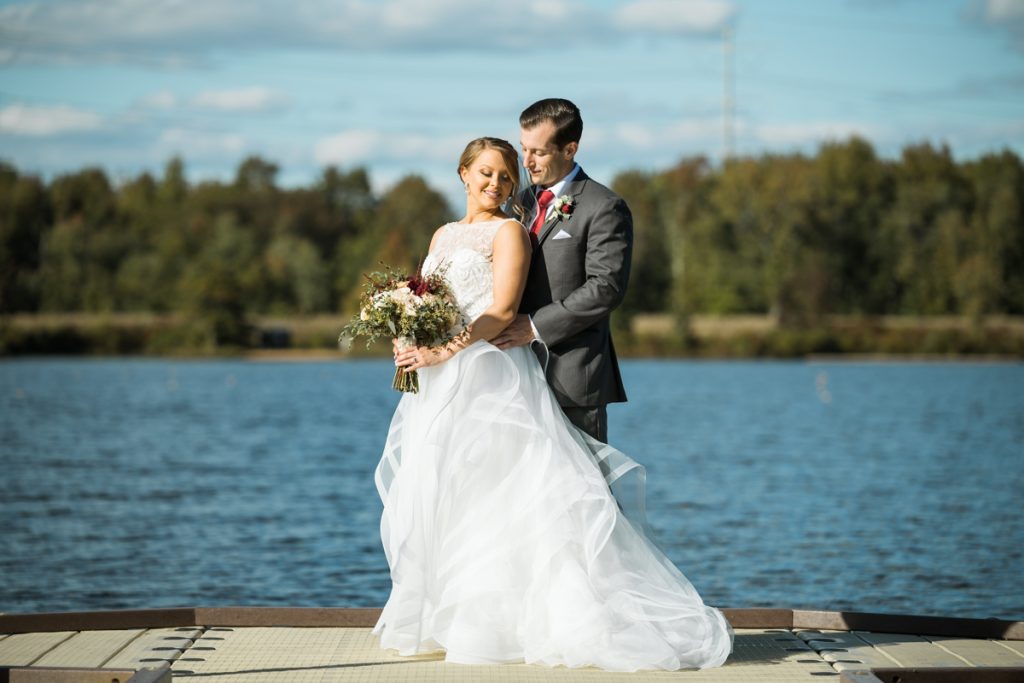 Sara and Dylan's gorgeous fall wedding at Boathouse at Mercer Lake in West Windsor Township, NJ. This beautiful waterfront wedding venue gives you the most gorgeous sunset at the end of the evening giving that perfect opportunity for the night shot to wrap up the magical wedding day.  Boathouse at Mercer Lake in West Windsor Township, NJ wedding celebrating Sara and Dylan captured by Steve from Pearl Paper Studio. Pearl Paper Studio is here to capture real emotions, fun couples with non-traditional wedding stories, now we are booking small intimate backyard wedding, outdoor tent wedding, farm wedding, elopements, nyc elopements. We are currently booking fall 2022 and 2023 weddings in NY, NJ and LI.