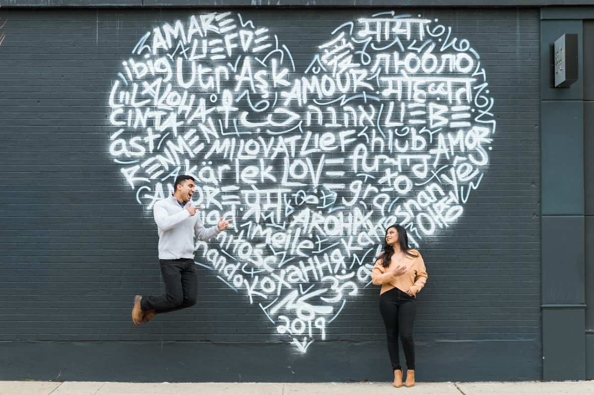 Reshma and Joel wanted a low key engagement session locally, so we met at downtown Englewood in front of a cafe. Reshma, Joel and MJ walked around streets of downtown Englewood looking for fun murals, church and interesting backdrop. Reshma and Joel's Englewood, NJ engagement session captures by MJ from Pearl Paper Studio. Pearl Paper Studio is here to capture real emotions, fun couples with non-traditional wedding stories, now we are booking small intimate backyard wedding, outdoor tent wedding, farm wedding, elopements, nyc elopements. We are currently booking fall 2022 and 2023 weddings in NY, NJ and LI.