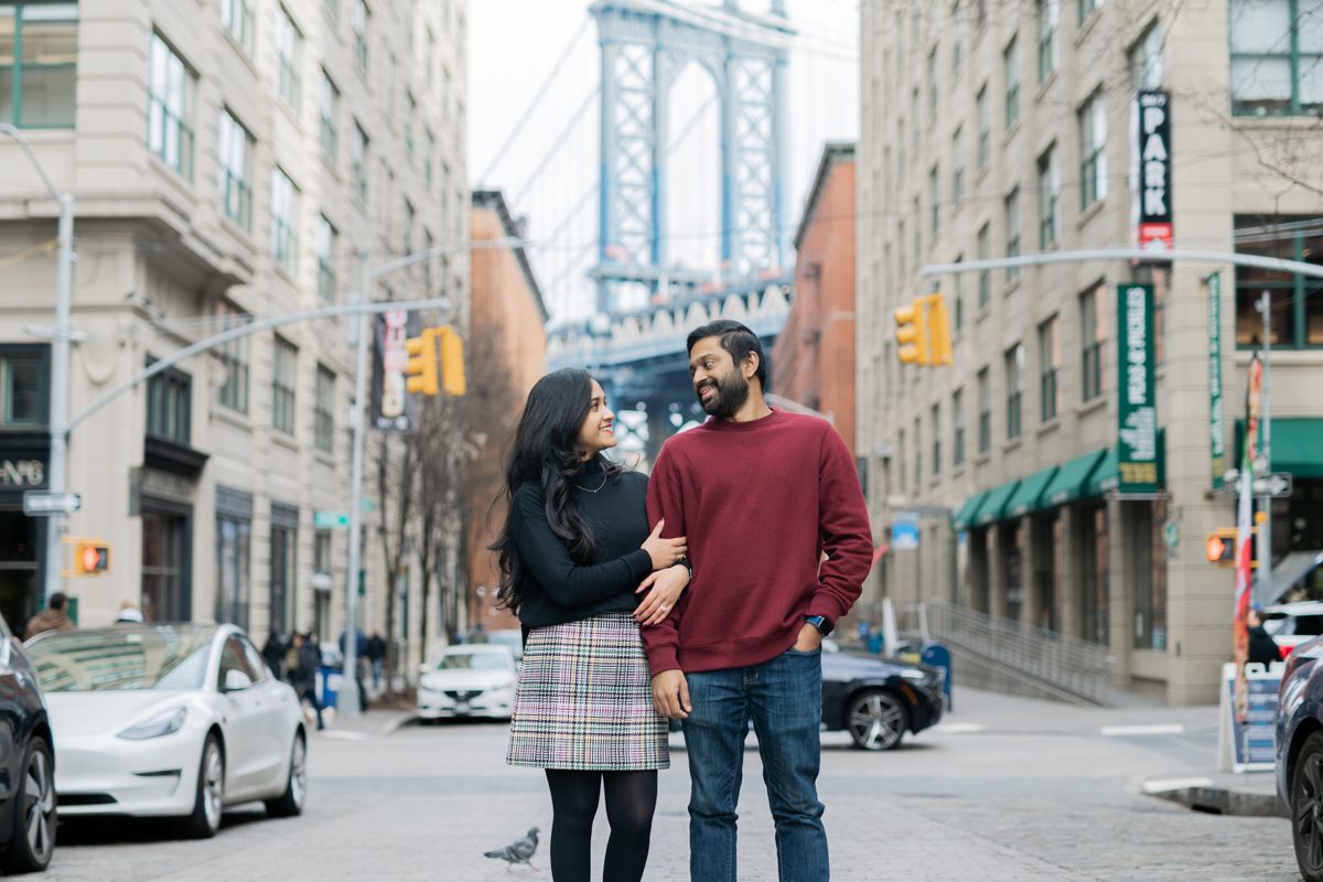 Kicking off 2023 engagement season with Vrinda and Ajith at Dumbo Brooklyn NY. While walking around rather chilly and cold Dumbo Brooklyn Vrinda and Ajith laughed and smiled. What is more beautiful than couple in love laughing, smiling and cracking up with each other. We love couple's having fun during their engagement. Vrinda and Ajith fun engagement Dumbo Brooklyn NY documented by Steve from Pearl Paper Studio. Pearl Paper Studio is here to capture real emotions, fun couples with non-traditional wedding stories, now we are booking small intimate backyard wedding, outdoor tent wedding, farm wedding, elopements, nyc elopements. We are currently booking fall 2022 and 2023 weddings in NJ, NY, Brooklyn and Long Island.