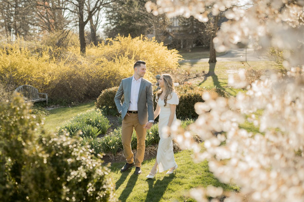 Back at our favorite engagement spot NJ Botanical Garden Ringwood NJ for Katie and Jon's spring engagement session documented by Steve. Spring was in full swing and green, yellow and pink colors were all over NJ Botanical Garden during Katie and Jon's engagement session. Katie and Jon's NJ Botanical Garden Engagement captured by Steve from Pearl Paper Studio. Pearl Paper Studio is here to capture real emotions, fun couples with non-traditional wedding stories, now we are booking small intimate backyard wedding, outdoor tent wedding, farm wedding, elopements, nyc elopements. We are currently booking fall 2022 and 2023 weddings in NJ, NY, Brooklyn and Long Island.