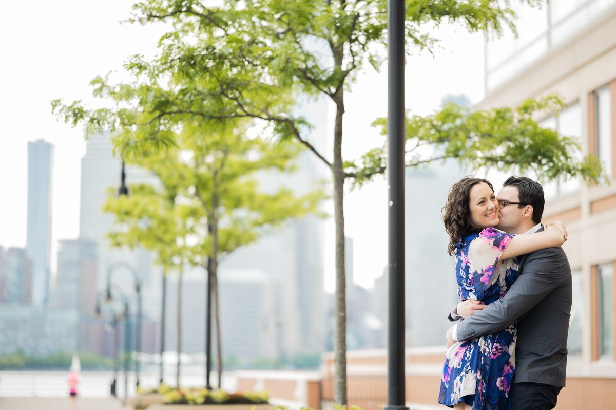 Lauren and Justin's Hoboken waterfront NJ engagement where we walked around the piers of Hoboken and we ended up Hoboken Path Station. Lauren and Justin laughed, smiled and had so much fun. Lauren and Justin's Hoboken NJ engagement session documented by MJ from Pearl Paper Studio. Pearl Paper Studio is here to capture real emotions, fun couples with non-traditional wedding stories, now we are booking small intimate backyard wedding, outdoor tent wedding, farm wedding, elopements, nyc elopements. We are currently booking fall 2023 and 2024 weddings in NJ, NY, Brooklyn and Long Island.