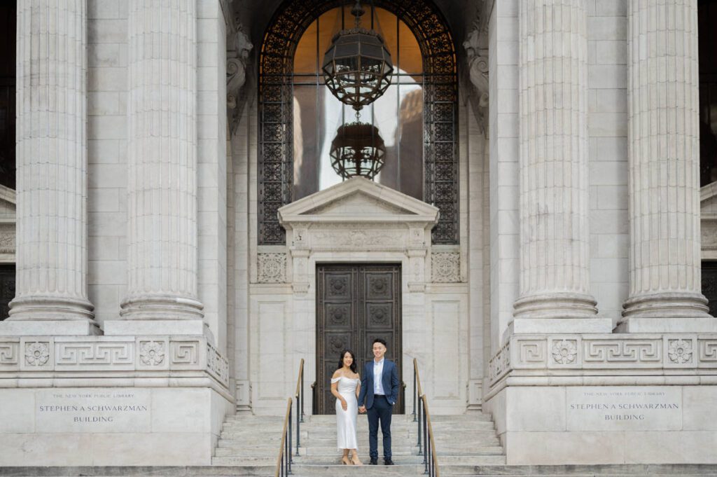 One of the most iconic building in NYC is NY Public Library amongst other buildings in NY. Sophia and Sam started their NYC engagement session at NY Public Library with tall white columns and iconic stairs followed by some subway shot which took them to Central Park. From NY Public Library to Bethesda Arcade, Bethesda Fountain and ending the session with some subway ride back can not be more NY that Sophia and Sam's NYC engagement session. Sophia and Sam's NY Public Library and Central Park engagement documented by MJ from Pearl Paper Studio. Pearl Paper Studio is here to capture real emotions, fun couples with non-traditional wedding stories, now we are booking small intimate backyard wedding, outdoor tent wedding, farm wedding, elopements, nyc elopements. We are currently booking fall 2023 and 2024 weddings in NJ, NY, Brooklyn and Long Island.