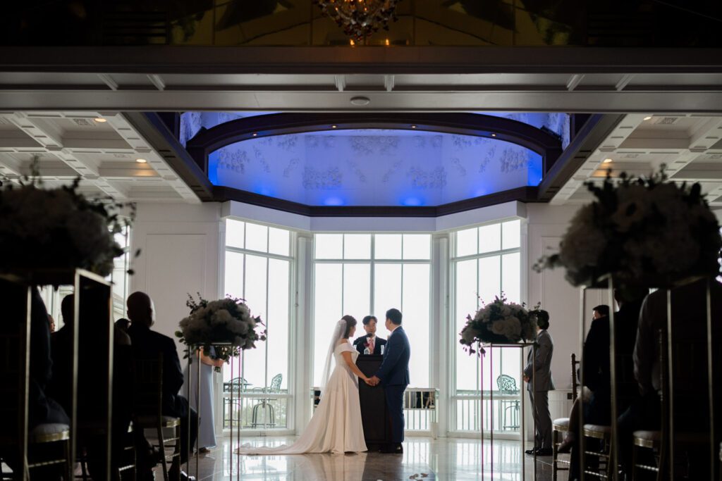 On a rainy October morning, the picturesque Westmount Country Club in NJ played host to the heartwarming union of Sally and Terry, two lovebirds from NJ. Opting for a daytime celebration, the early start added a unique charm to their wedding day.
The bridal suite at Westmount Country Club buzzed with activity as the ladies had their hair and makeup done, while Terry and his groomsmen prepared for the day ahead. Rain forced us to adjust our plans, moving all the photo sessions indoors – from the first look to family photos and the intimate couple's portraits.
Despite the initial change of plans, as we wrapped up the indoor sessions, the rain graciously subsided, allowing Sally and Terry a brief venture outside for a few natural light photos. The spontaneity added a touch of magic to their album.
As guests began to arrive, the beautiful ceremony unfolded, uniting Sally and Terry amidst the warm ambiance of Westmount Country Club. Surrounded by friends and family, they relished in the delectable food and drinks, transforming their wedding day into a joyous celebration that echoed with laughter and love.
 Sally and Terry's Westmount Country Club NJ wedding documented & photographed by Steve from Pearl Paper Studio. Pearl Paper Studio is here to capture real emotions, fun couples with non-traditional wedding stories, now we are booking small intimate backyard wedding, outdoor tent wedding, farm wedding, elopements, nyc elopements. We are currently booking fall 2023 and 2024 weddings in NJ, NY, Brooklyn and Long Island.