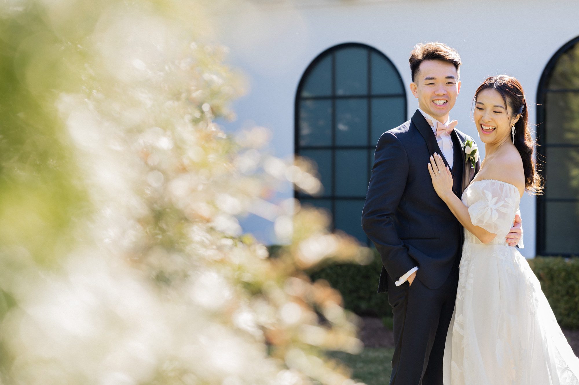 On April 7, 2024, Sophia and Sam tied the knot at the stunning Perona Farms in Andover, NJ. The day was filled with joy, love, and a series of beautiful moments that I was privileged to capture as their photographer.

Sophia and Sam began their day by getting ready on-site at Perona Farms. The air was filled with excitement and anticipation as the couple prepared for their big day. Once they were ready, Sophia and Sam shared an intimate first look on the rooftop of The Reserve, a magical moment framed by the panoramic views. Following this touching moment, they strolled through the picturesque grounds of Perona Farms for their wedding photos, capturing the essence of their love against the backdrop of blooming gardens and rustic charm.

Before the official ceremony, Sophia and Sam honored their heritage with a traditional Chinese Tea Ceremony. During this ceremony, the couple served tea to their elders, who in return presented them with wedding gifts, often gold jewelry, symbolizing prosperity and good fortune. It was a heartwarming tradition that added a meaningful layer to their special day.

With the tea ceremony complete, Sophia took a moment to touch up her makeup and hair, ensuring she was picture-perfect for the upcoming ceremony. Guests gathered on the rooftop of The Reserve, eagerly awaiting the bride and groom. Sam walked in first, his eyes lighting up as he watched Sophia gracefully make her way down the aisle, escorted by her parents and their beloved fur baby. The ceremony was sweet and heartfelt, culminating in a tender kiss that sealed their vows.

The celebration continued with a delightful cocktail hour at Perona Farms, where guests mingled and enjoyed an array of delicious hors d'oeuvres. As the sun began to set, Sophia and Sam kicked off their reception with a choreographed first dance that left everyone in awe. Their graceful movements and evident joy set the tone for an unforgettable evening.

The reception at The Reserve at Perona Farms was a lively affair, filled with laughter, dancing, and joyous celebration. The couple's loved ones joined them on the dance floor, making memories that would last a lifetime. From the heartfelt toasts to the energetic dancing, the night was a perfect reflection of Sophia and Sam's love and commitment to each other.


Sophia and Sam The Reserve Perona Farms Andover NJ Wedding photographed by MJ from Pearl Paper Studio. Pearl Paper Studio is here to capture real emotions, fun couples with non-traditional wedding stories, now we are booking small intimate backyard wedding, outdoor tent wedding, farm wedding, elopements, nyc elopements. We are currently booking 2024 weddings in NJ, NY, Brooklyn and Long Island.