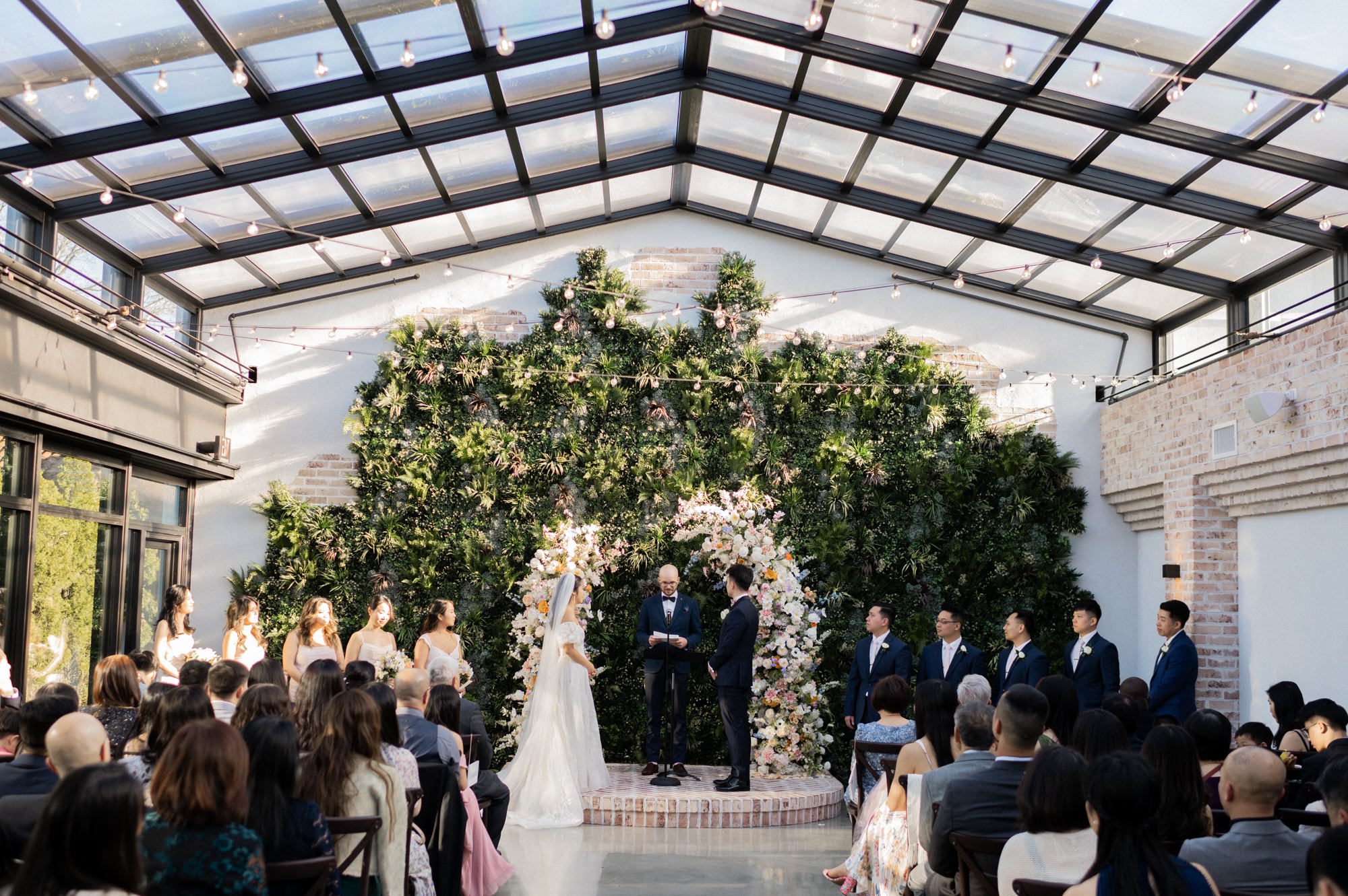 On April 7, 2024, Sophia and Sam tied the knot at the stunning Perona Farms in Andover, NJ. The day was filled with joy, love, and a series of beautiful moments that I was privileged to capture as their photographer.

Sophia and Sam began their day by getting ready on-site at Perona Farms. The air was filled with excitement and anticipation as the couple prepared for their big day. Once they were ready, Sophia and Sam shared an intimate first look on the rooftop of The Reserve, a magical moment framed by the panoramic views. Following this touching moment, they strolled through the picturesque grounds of Perona Farms for their wedding photos, capturing the essence of their love against the backdrop of blooming gardens and rustic charm.

Before the official ceremony, Sophia and Sam honored their heritage with a traditional Chinese Tea Ceremony. During this ceremony, the couple served tea to their elders, who in return presented them with wedding gifts, often gold jewelry, symbolizing prosperity and good fortune. It was a heartwarming tradition that added a meaningful layer to their special day.

With the tea ceremony complete, Sophia took a moment to touch up her makeup and hair, ensuring she was picture-perfect for the upcoming ceremony. Guests gathered on the rooftop of The Reserve, eagerly awaiting the bride and groom. Sam walked in first, his eyes lighting up as he watched Sophia gracefully make her way down the aisle, escorted by her parents and their beloved fur baby. The ceremony was sweet and heartfelt, culminating in a tender kiss that sealed their vows.

The celebration continued with a delightful cocktail hour at Perona Farms, where guests mingled and enjoyed an array of delicious hors d'oeuvres. As the sun began to set, Sophia and Sam kicked off their reception with a choreographed first dance that left everyone in awe. Their graceful movements and evident joy set the tone for an unforgettable evening.

The reception at The Reserve at Perona Farms was a lively affair, filled with laughter, dancing, and joyous celebration. The couple's loved ones joined them on the dance floor, making memories that would last a lifetime. From the heartfelt toasts to the energetic dancing, the night was a perfect reflection of Sophia and Sam's love and commitment to each other.


Sophia and Sam The Reserve Perona Farms Andover NJ Wedding photographed by MJ from Pearl Paper Studio. Pearl Paper Studio is here to capture real emotions, fun couples with non-traditional wedding stories, now we are booking small intimate backyard wedding, outdoor tent wedding, farm wedding, elopements, nyc elopements. We are currently booking 2024 weddings in NJ, NY, Brooklyn and Long Island.