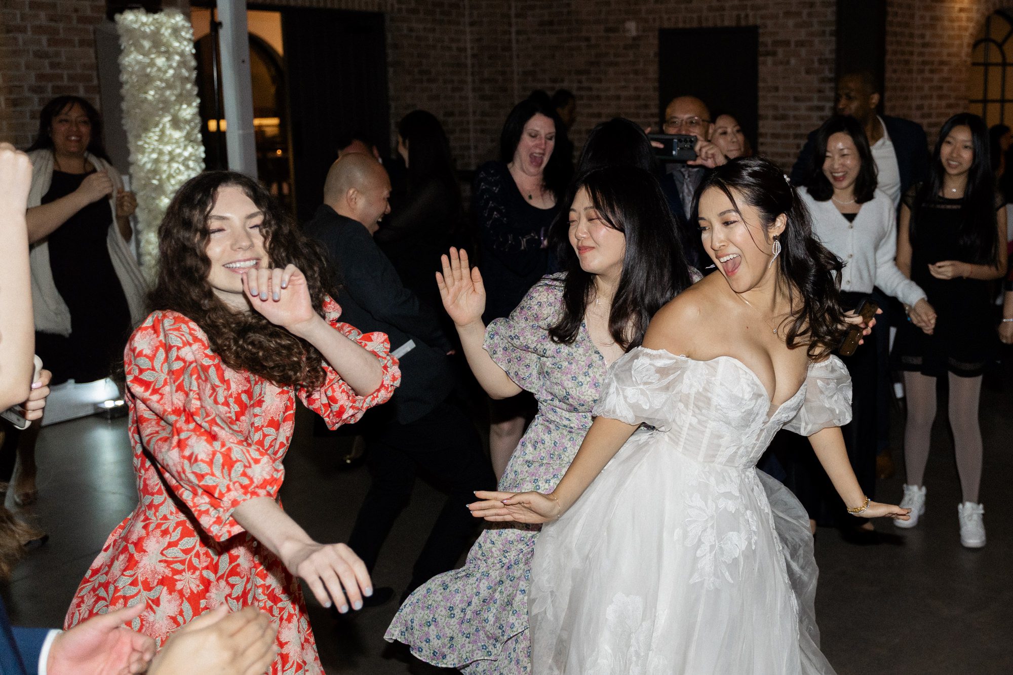 On April 7, 2024, Sophia and Sam tied the knot at the stunning Perona Farms in Andover, NJ. The day was filled with joy, love, and a series of beautiful moments that I was privileged to capture as their photographer.

Sophia and Sam began their day by getting ready on-site at Perona Farms. The air was filled with excitement and anticipation as the couple prepared for their big day. Once they were ready, Sophia and Sam shared an intimate first look on the rooftop of The Reserve, a magical moment framed by the panoramic views. Following this touching moment, they strolled through the picturesque grounds of Perona Farms for their wedding photos, capturing the essence of their love against the backdrop of blooming gardens and rustic charm.

Before the official ceremony, Sophia and Sam honored their heritage with a traditional Chinese Tea Ceremony. During this ceremony, the couple served tea to their elders, who in return presented them with wedding gifts, often gold jewelry, symbolizing prosperity and good fortune. It was a heartwarming tradition that added a meaningful layer to their special day.

With the tea ceremony complete, Sophia took a moment to touch up her makeup and hair, ensuring she was picture-perfect for the upcoming ceremony. Guests gathered on the rooftop of The Reserve, eagerly awaiting the bride and groom. Sam walked in first, his eyes lighting up as he watched Sophia gracefully make her way down the aisle, escorted by her parents and their beloved fur baby. The ceremony was sweet and heartfelt, culminating in a tender kiss that sealed their vows.

The celebration continued with a delightful cocktail hour at Perona Farms, where guests mingled and enjoyed an array of delicious hors d'oeuvres. As the sun began to set, Sophia and Sam kicked off their reception with a choreographed first dance that left everyone in awe. Their graceful movements and evident joy set the tone for an unforgettable evening.

The reception at The Reserve at Perona Farms was a lively affair, filled with laughter, dancing, and joyous celebration. The couple's loved ones joined them on the dance floor, making memories that would last a lifetime. From the heartfelt toasts to the energetic dancing, the night was a perfect reflection of Sophia and Sam's love and commitment to each other.


Sophia and Sam The Reserve Perona Farms Andover NJ Wedding photographed by MJ from Pearl Paper Studio. Pearl Paper Studio is here to capture real emotions, fun couples with non-traditional wedding stories, now we are booking small intimate backyard wedding, outdoor tent wedding, farm wedding, elopements, nyc elopements. We are currently booking 2024 weddings in NJ, NY, Brooklyn and Long Island.