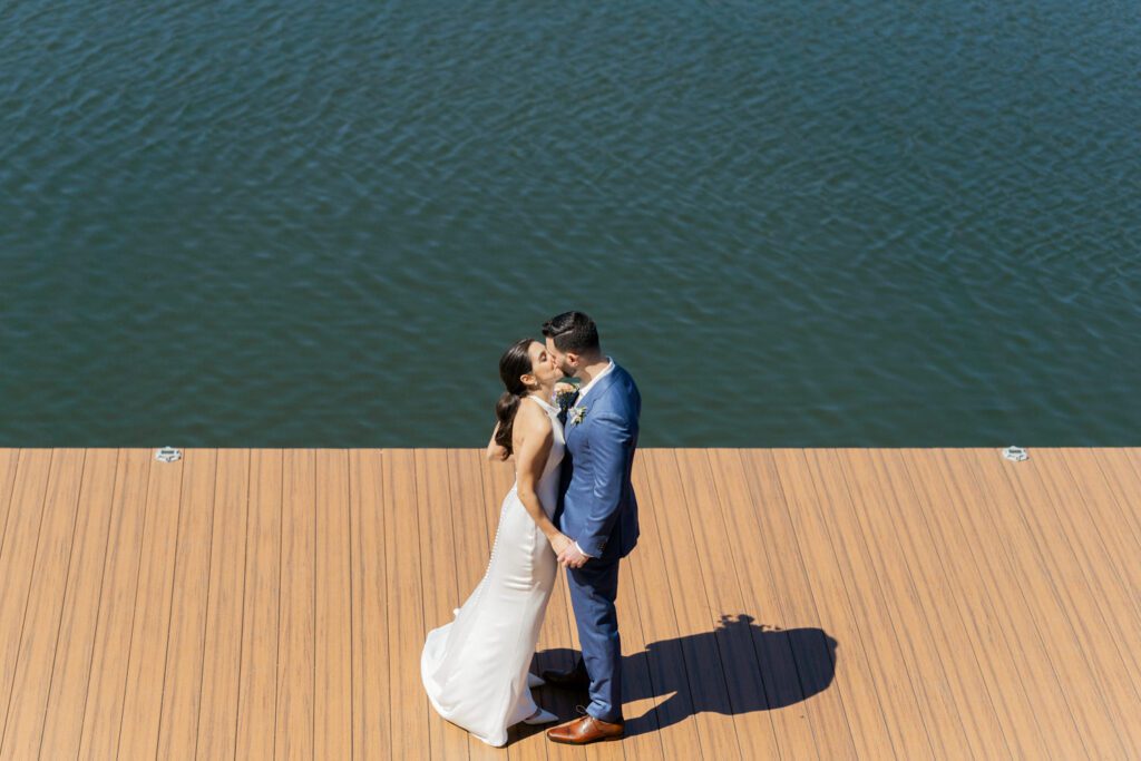 On April 25, I had the pleasure of documenting Gabriella and Joseph's wedding at the beautiful Rock Island Lake Club in Sparta, NJ. The venue provided a stunning backdrop for their special day, starting with Gabriella's elegant entrance in her simple yet stunning Jenny Yoon dress. The moment she walked down the dock for a first look with Joe was nothing short of magical.
Hope and Lilly from Strange Vine Studio truly outdid themselves with the decor. The outdoor ceremony area, set against the serene lake, was a picturesque setting for Gabriella and Joe's vows. Inside, the reception room was equally breathtaking, perfectly adorned to celebrate the newlyweds.
Gabriella and Joe's wedding day was filled with laughter and good vibes, all made even more memorable by the enchanting atmosphere of Rock Island Lake Club. The venue's natural beauty and impeccable amenities provided the perfect setting for this unforgettable celebration.

Gabriella and Joe Rock Island Lake Club Sparta NJ Wedding photographed by Steve from Pearl Paper Studio. Pearl Paper Studio is here to capture real emotions, fun couples with non-traditional wedding stories, now we are booking small intimate backyard wedding, outdoor tent wedding, farm wedding, elopements, nyc elopements. We are currently booking 2024 weddings in NJ, NY, Brooklyn and Long Island.
