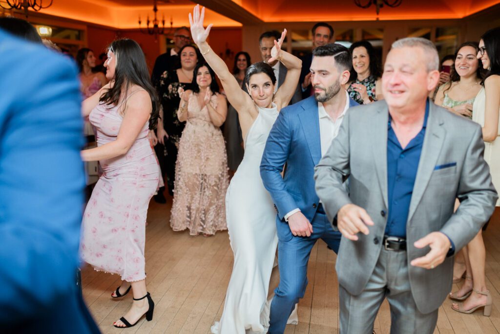 On April 25, I had the pleasure of documenting Gabriella and Joseph's wedding at the beautiful Rock Island Lake Club in Sparta, NJ. The venue provided a stunning backdrop for their special day, starting with Gabriella's elegant entrance in her simple yet stunning Jenny Yoon dress. The moment she walked down the dock for a first look with Joe was nothing short of magical.
Hope and Lilly from Strange Vine Studio truly outdid themselves with the decor. The outdoor ceremony area, set against the serene lake, was a picturesque setting for Gabriella and Joe's vows. Inside, the reception room was equally breathtaking, perfectly adorned to celebrate the newlyweds.
Gabriella and Joe's wedding day was filled with laughter and good vibes, all made even more memorable by the enchanting atmosphere of Rock Island Lake Club. The venue's natural beauty and impeccable amenities provided the perfect setting for this unforgettable celebration.

Gabriella and Joe Rock Island Lake Club Sparta NJ Wedding photographed by Steve from Pearl Paper Studio. Pearl Paper Studio is here to capture real emotions, fun couples with non-traditional wedding stories, now we are booking small intimate backyard wedding, outdoor tent wedding, farm wedding, elopements, nyc elopements. We are currently booking 2024 weddings in NJ, NY, Brooklyn and Long Island.
