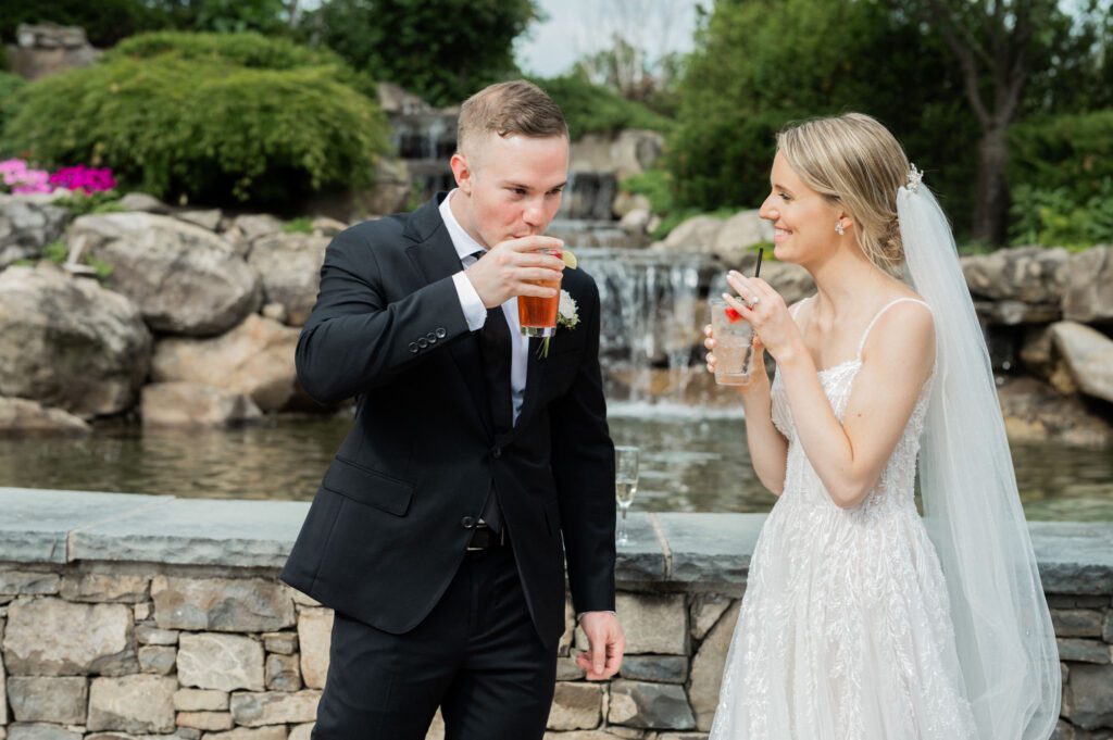 On June 2, 2024, I had the pleasure of photographing the beautiful wedding of Kristen Boonie and Ryan Piscopo at the stunning West Hills Country Club in Middletown, NY. The day was filled with love, joy, and picturesque moments that made for an unforgettable celebration.
Kristen and Ryan shared their first look on the lush green grass of West Hills Country Club, setting the tone for a day full of love and laughter. As we walked around the gorgeous property, we captured their wedding portraits amidst the vibrant blooms that provided a perfect backdrop for their special day.
The outdoor ceremony took place facing the golf course, offering a serene and peaceful view for all the guests. Blessed with amazing weather, the guests enjoyed the outdoors, reveling in the lush green field and the charming water fountain.
As the sun began to set, the reception music by Spin Doctor Entertainment filled the air, and guests moved into the beautifully set up tent. The floral decor by Deja Vu Floral Design added an extra touch of elegance, making the space under the expansive tent shine even more beautifully.
The reception began with Kristen and Ryan making their grand entrance, and the celebration kicked off in high spirits. Surrounded by their family and friends, they celebrated their love and new journey together at the picturesque West Hills Country Club.
West Hills Country Club provided a breathtaking setting for Kristen and Ryan's wedding day, with its lush landscapes, beautiful blooms, and elegant spaces. It was a day to remember, filled with love, laughter, and stunning scenery.
Kristen and Ryan West Hills Country Club NY Wedding photographed by MJ from Pearl Paper Studio. Pearl Paper Studio is here to capture real emotions, fun couples with non-traditional wedding stories, now we are booking small intimate backyard wedding, outdoor tent wedding, farm wedding, elopements, nyc elopements. We are currently booking 2024 weddings in NJ, NY, Brooklyn and Long Island.