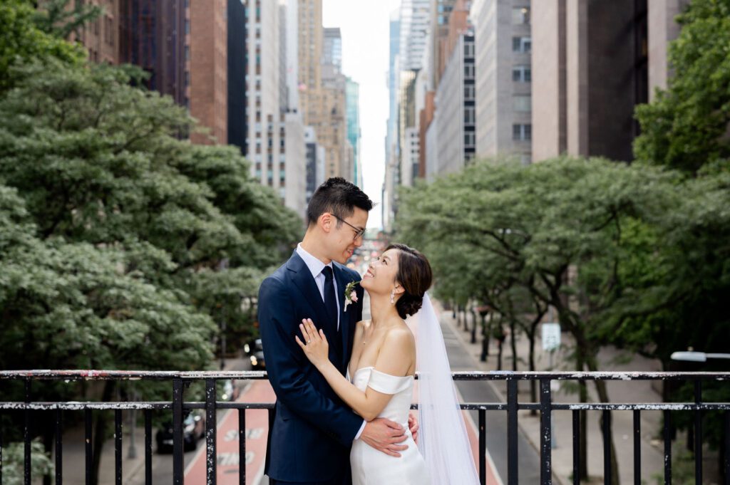 Vivian & Albert’s Stunning NYC Wedding | June 8, 2024

Vivian and Albert’s wedding day was nothing short of magical! It was a perfect blend of elegance, love, and joy in the heart of New York City.

The day began at the chic and modern Thompson Central Park Hotel, where both Vivian and Albert got ready. With its luxurious suites and iconic city views, the hotel provided the perfect backdrop for the early moments of their special day. Vivian looked radiant as she slipped into her stunning gown, while Albert’s classic suit added a timeless charm.

Their first look and formal portraits took place at the serene Tudor City Greens, a hidden gem in Manhattan. This lush urban oasis, surrounded by historic architecture, offered a romantic and intimate setting for their photos. From their heartfelt first look to the joyful family and wedding party portraits, every moment captured the couple’s excitement and love for each other.

After wrapping up the photos around 4:30 PM, the festivities moved to Park Asia in Brooklyn. This spacious and stylish venue seamlessly combines modern elegance with traditional charm, making it an ideal location for Vivian and Albert’s celebration.

The ceremony was heartfelt, with friends and family gathered to witness their vows in an atmosphere filled with love. During the cocktail hour, guests enjoyed a variety of delicious hors d'oeuvres while mingling and sharing laughter. The reception that followed was an unforgettable evening of fantastic food, emotional speeches, and lively dancing.

Vivian and Albert’s wedding day was a beautiful celebration of their love, and I feel so honored to have been a part of it. Congratulations, Vivian and Albert—here’s to a lifetime of happiness together!