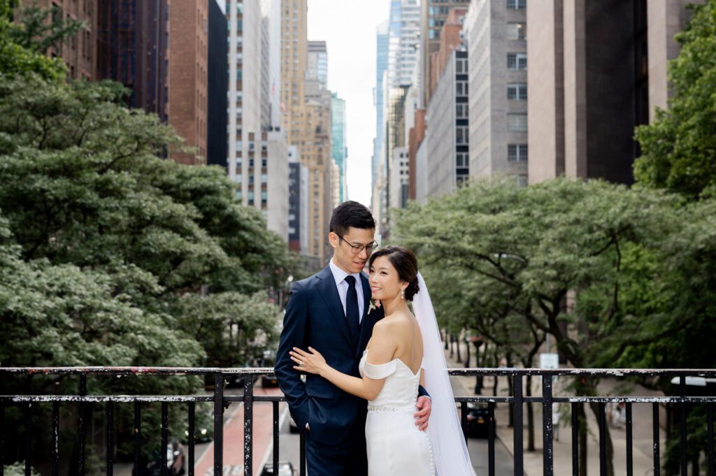 Vivian & Albert’s Stunning NYC Wedding | June 8, 2024

Vivian and Albert’s wedding day was nothing short of magical! It was a perfect blend of elegance, love, and joy in the heart of New York City.

The day began at the chic and modern Thompson Central Park Hotel, where both Vivian and Albert got ready. With its luxurious suites and iconic city views, the hotel provided the perfect backdrop for the early moments of their special day. Vivian looked radiant as she slipped into her stunning gown, while Albert’s classic suit added a timeless charm.

Their first look and formal portraits took place at the serene Tudor City Greens, a hidden gem in Manhattan. This lush urban oasis, surrounded by historic architecture, offered a romantic and intimate setting for their photos. From their heartfelt first look to the joyful family and wedding party portraits, every moment captured the couple’s excitement and love for each other.

After wrapping up the photos around 4:30 PM, the festivities moved to Park Asia in Brooklyn. This spacious and stylish venue seamlessly combines modern elegance with traditional charm, making it an ideal location for Vivian and Albert’s celebration.

The ceremony was heartfelt, with friends and family gathered to witness their vows in an atmosphere filled with love. During the cocktail hour, guests enjoyed a variety of delicious hors d'oeuvres while mingling and sharing laughter. The reception that followed was an unforgettable evening of fantastic food, emotional speeches, and lively dancing.

Vivian and Albert’s wedding day was a beautiful celebration of their love, and I feel so honored to have been a part of it. Congratulations, Vivian and Albert—here’s to a lifetime of happiness together!