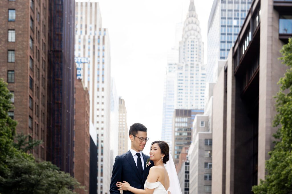 Vivian & Albert’s Stunning NYC Wedding | June 8, 2024

Vivian and Albert’s wedding day was nothing short of magical! It was a perfect blend of elegance, love, and joy in the heart of New York City.

The day began at the chic and modern Thompson Central Park Hotel, where both Vivian and Albert got ready. With its luxurious suites and iconic city views, the hotel provided the perfect backdrop for the early moments of their special day. Vivian looked radiant as she slipped into her stunning gown, while Albert’s classic suit added a timeless charm.

Their first look and formal portraits took place at the serene Tudor City Greens, a hidden gem in Manhattan. This lush urban oasis, surrounded by historic architecture, offered a romantic and intimate setting for their photos. From their heartfelt first look to the joyful family and wedding party portraits, every moment captured the couple’s excitement and love for each other.

After wrapping up the photos around 4:30 PM, the festivities moved to Park Asia in Brooklyn. This spacious and stylish venue seamlessly combines modern elegance with traditional charm, making it an ideal location for Vivian and Albert’s celebration.

The ceremony was heartfelt, with friends and family gathered to witness their vows in an atmosphere filled with love. During the cocktail hour, guests enjoyed a variety of delicious hors d'oeuvres while mingling and sharing laughter. The reception that followed was an unforgettable evening of fantastic food, emotional speeches, and lively dancing.

Vivian and Albert’s wedding day was a beautiful celebration of their love, and I feel so honored to have been a part of it. Congratulations, Vivian and Albert—here’s to a lifetime of happiness together!