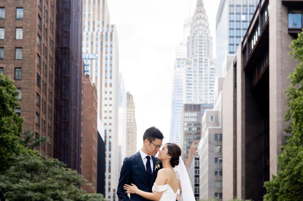 Vivian & Albert’s Stunning NYC Wedding | June 8, 2024

Vivian and Albert’s wedding day was nothing short of magical! It was a perfect blend of elegance, love, and joy in the heart of New York City.

The day began at the chic and modern Thompson Central Park Hotel, where both Vivian and Albert got ready. With its luxurious suites and iconic city views, the hotel provided the perfect backdrop for the early moments of their special day. Vivian looked radiant as she slipped into her stunning gown, while Albert’s classic suit added a timeless charm.

Their first look and formal portraits took place at the serene Tudor City Greens, a hidden gem in Manhattan. This lush urban oasis, surrounded by historic architecture, offered a romantic and intimate setting for their photos. From their heartfelt first look to the joyful family and wedding party portraits, every moment captured the couple’s excitement and love for each other.

After wrapping up the photos around 4:30 PM, the festivities moved to Park Asia in Brooklyn. This spacious and stylish venue seamlessly combines modern elegance with traditional charm, making it an ideal location for Vivian and Albert’s celebration.

The ceremony was heartfelt, with friends and family gathered to witness their vows in an atmosphere filled with love. During the cocktail hour, guests enjoyed a variety of delicious hors d'oeuvres while mingling and sharing laughter. The reception that followed was an unforgettable evening of fantastic food, emotional speeches, and lively dancing.

Vivian and Albert’s wedding day was a beautiful celebration of their love, and I feel so honored to have been a part of it. Congratulations, Vivian and Albert—here’s to a lifetime of happiness together!