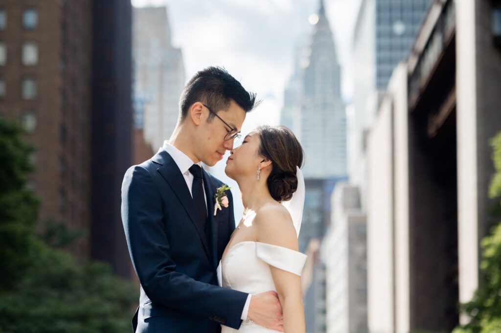 Vivian & Albert’s Stunning NYC Wedding | June 8, 2024

Vivian and Albert’s wedding day was nothing short of magical! It was a perfect blend of elegance, love, and joy in the heart of New York City.

The day began at the chic and modern Thompson Central Park Hotel, where both Vivian and Albert got ready. With its luxurious suites and iconic city views, the hotel provided the perfect backdrop for the early moments of their special day. Vivian looked radiant as she slipped into her stunning gown, while Albert’s classic suit added a timeless charm.

Their first look and formal portraits took place at the serene Tudor City Greens, a hidden gem in Manhattan. This lush urban oasis, surrounded by historic architecture, offered a romantic and intimate setting for their photos. From their heartfelt first look to the joyful family and wedding party portraits, every moment captured the couple’s excitement and love for each other.

After wrapping up the photos around 4:30 PM, the festivities moved to Park Asia in Brooklyn. This spacious and stylish venue seamlessly combines modern elegance with traditional charm, making it an ideal location for Vivian and Albert’s celebration.

The ceremony was heartfelt, with friends and family gathered to witness their vows in an atmosphere filled with love. During the cocktail hour, guests enjoyed a variety of delicious hors d'oeuvres while mingling and sharing laughter. The reception that followed was an unforgettable evening of fantastic food, emotional speeches, and lively dancing.

Vivian and Albert’s wedding day was a beautiful celebration of their love, and I feel so honored to have been a part of it. Congratulations, Vivian and Albert—here’s to a lifetime of happiness together!