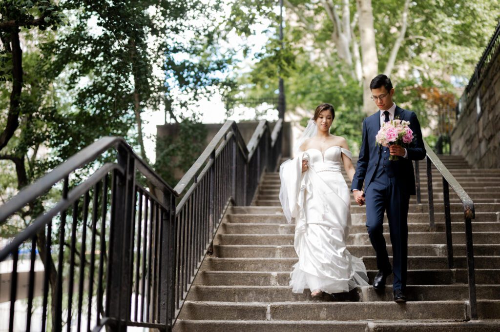 Vivian & Albert’s Stunning NYC Wedding | June 8, 2024

Vivian and Albert’s wedding day was nothing short of magical! It was a perfect blend of elegance, love, and joy in the heart of New York City.

The day began at the chic and modern Thompson Central Park Hotel, where both Vivian and Albert got ready. With its luxurious suites and iconic city views, the hotel provided the perfect backdrop for the early moments of their special day. Vivian looked radiant as she slipped into her stunning gown, while Albert’s classic suit added a timeless charm.

Their first look and formal portraits took place at the serene Tudor City Greens, a hidden gem in Manhattan. This lush urban oasis, surrounded by historic architecture, offered a romantic and intimate setting for their photos. From their heartfelt first look to the joyful family and wedding party portraits, every moment captured the couple’s excitement and love for each other.

After wrapping up the photos around 4:30 PM, the festivities moved to Park Asia in Brooklyn. This spacious and stylish venue seamlessly combines modern elegance with traditional charm, making it an ideal location for Vivian and Albert’s celebration.

The ceremony was heartfelt, with friends and family gathered to witness their vows in an atmosphere filled with love. During the cocktail hour, guests enjoyed a variety of delicious hors d'oeuvres while mingling and sharing laughter. The reception that followed was an unforgettable evening of fantastic food, emotional speeches, and lively dancing.

Vivian and Albert’s wedding day was a beautiful celebration of their love, and I feel so honored to have been a part of it. Congratulations, Vivian and Albert—here’s to a lifetime of happiness together!