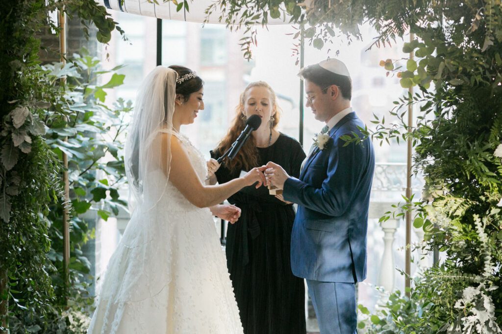 Nikki and Spencer’s wedding day was a perfect blend of heartfelt moments, breathtaking views, and joyous celebration in the heart of Manhattan.
The day began at the Hyatt Herald Square, where both the bride and groom got ready. Before heading out, Nikki and Spencer each shared emotional first-look moments with their parents, setting a beautiful tone for the day ahead.
The couple then made their way to the iconic New York Public Library and Bryant Park for their formal photos. Surrounded by their wedding party and family, the historic architecture and lush park provided a stunning backdrop for capturing unforgettable memories.
The ceremony took place on the rooftop Terrace at Midtown Loft & Terrace. This incredible space, featuring a retractable enclosed rooftop, offers a lush landscaped setting with sweeping 360-degree views of the Manhattan skyline. Guests were treated to vistas of iconic landmarks, including the Empire State Building and Marble Collegiate Church, making the moment even more magical.
After the ceremony, everyone moved indoors to the elegant Loft, which boasts high ceilings and large windows that frame the city’s skyline beautifully. The space perfectly complemented Nikki and Spencer’s vision for their wedding, providing a warm and stylish setting for the evening’s festivities.
The newlyweds shared laughter, happy tears, and countless unforgettable moments with their friends and family. As the night unfolded, the dance floor was alive with celebration, marking the perfect end to Nikki and Spencer’s extraordinary day at Midtown Loft & Terrace.
Congratulations, Nikki and Spencer! Your wedding was a true reflection of your love and joy, and I’m so honored to have captured it all.
Nikki and Spencer Midtown Loft and Terrace NY Wedding photographed by MJ from Pearl Paper Studio. Pearl Paper Studio is here to capture real emotions, fun couples with non-traditional wedding stories, now we are booking small intimate backyard wedding, outdoor tent wedding, farm wedding, elopements, nyc elopements. We are currently booking 2025 and 2026 weddings in NJ, Manhattan, Hudson Valley NY, Brooklyn and Long Island.