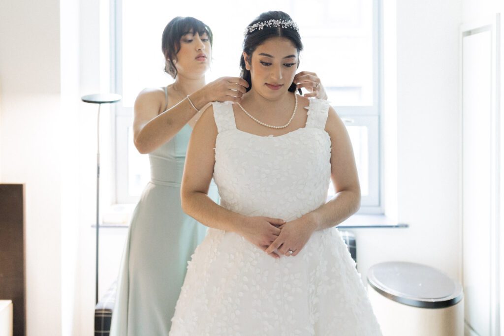 Nikki and Spencer’s wedding day was a perfect blend of heartfelt moments, breathtaking views, and joyous celebration in the heart of Manhattan.
The day began at the Hyatt Herald Square, where both the bride and groom got ready. Before heading out, Nikki and Spencer each shared emotional first-look moments with their parents, setting a beautiful tone for the day ahead.
The couple then made their way to the iconic New York Public Library and Bryant Park for their formal photos. Surrounded by their wedding party and family, the historic architecture and lush park provided a stunning backdrop for capturing unforgettable memories.
The ceremony took place on the rooftop Terrace at Midtown Loft & Terrace. This incredible space, featuring a retractable enclosed rooftop, offers a lush landscaped setting with sweeping 360-degree views of the Manhattan skyline. Guests were treated to vistas of iconic landmarks, including the Empire State Building and Marble Collegiate Church, making the moment even more magical.
After the ceremony, everyone moved indoors to the elegant Loft, which boasts high ceilings and large windows that frame the city’s skyline beautifully. The space perfectly complemented Nikki and Spencer’s vision for their wedding, providing a warm and stylish setting for the evening’s festivities.
The newlyweds shared laughter, happy tears, and countless unforgettable moments with their friends and family. As the night unfolded, the dance floor was alive with celebration, marking the perfect end to Nikki and Spencer’s extraordinary day at Midtown Loft & Terrace.
Congratulations, Nikki and Spencer! Your wedding was a true reflection of your love and joy, and I’m so honored to have captured it all.
Nikki and Spencer Midtown Loft and Terrace NY Wedding photographed by MJ from Pearl Paper Studio. Pearl Paper Studio is here to capture real emotions, fun couples with non-traditional wedding stories, now we are booking small intimate backyard wedding, outdoor tent wedding, farm wedding, elopements, nyc elopements. We are currently booking 2025 and 2026 weddings in NJ, Manhattan, Hudson Valley NY, Brooklyn and Long Island.