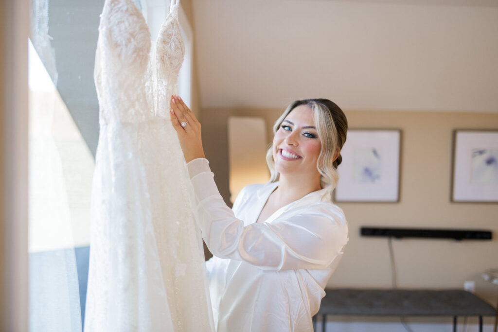 Emily and Frank Rock Island Lake Club, NJ 
Winter weddings are magical, and Emily and Frank’s November celebration at Rock Island Lake Club in Sparta, NJ, was the perfect example of just how enchanting they can be! Who says winter weddings can’t be fun? Despite the chilly weather, their special day was filled with warmth, laughter, and love—a true testament to their joyful spirits and the magic of this incredible venue.
Emily and Frank embraced the crisp November air with an outdoor ceremony by the picturesque lake at Rock Island Lake Club. The serene water, framed by the natural beauty of the surrounding landscape, created an unforgettable backdrop for their vows. Guests bundled up in cozy wraps and blankets, their smiles radiating as they witnessed the couple’s heartfelt promises. The venue’s dedicated team ensured every detail was perfectly executed, making the ceremony seamless.
After the ceremony, the celebration continued with one of the best cocktail hours in all of New Jersey. Rock Island Lake Club is renowned for its exceptional cuisine and creative presentation, and this event was no exception. Guests enjoyed an array of delicious hors d’oeuvres and drinks while mingling in the warm and inviting indoor spaces, thoughtfully designed to complement the venue’s lakeside charm.
The reception was a lively affair, with the dance floor packed from the first song to the last. Friends and family came together to celebrate Emily and Frank’s love, creating an atmosphere of pure joy. The stunning reception room at Rock Island Lake Club, with its elegant décor and large windows overlooking the lake, provided the perfect setting for a night of dancing, laughter, and unforgettable memories.
Rock Island Lake Club truly excels at hosting weddings year-round, but winter weddings here have a special kind of magic. From the attentive staff to the breathtaking views, every aspect of this venue enhances the celebration. Emily and Frank’s wedding day is proof that even on the coldest days, love and happiness can shine brighter than ever.
If you’re considering a winter wedding, Rock Island Lake Club is the perfect venue to bring your vision to life. Emily and Frank’s celebration was a testament to the beauty of the season and the power of love to warm even the chilliest of days.
Emily and Frank Rock Island Lake Club NJ Wedding photographed by Steve from Pearl Paper Studio. Pearl Paper Studio is here to capture real emotions, fun couples with non-traditional wedding stories, now we are booking small intimate backyard wedding, outdoor tent wedding, farm wedding, elopements, nyc elopements. We are currently booking 2025 and 2026 weddings in NJ, Manhattan, Hudson Valley NY, Brooklyn and Long Island.
