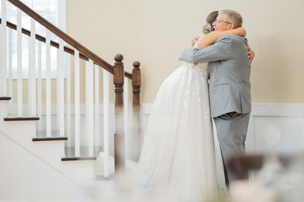 Emily and Frank Rock Island Lake Club, NJ 
Winter weddings are magical, and Emily and Frank’s November celebration at Rock Island Lake Club in Sparta, NJ, was the perfect example of just how enchanting they can be! Who says winter weddings can’t be fun? Despite the chilly weather, their special day was filled with warmth, laughter, and love—a true testament to their joyful spirits and the magic of this incredible venue.
Emily and Frank embraced the crisp November air with an outdoor ceremony by the picturesque lake at Rock Island Lake Club. The serene water, framed by the natural beauty of the surrounding landscape, created an unforgettable backdrop for their vows. Guests bundled up in cozy wraps and blankets, their smiles radiating as they witnessed the couple’s heartfelt promises. The venue’s dedicated team ensured every detail was perfectly executed, making the ceremony seamless.
After the ceremony, the celebration continued with one of the best cocktail hours in all of New Jersey. Rock Island Lake Club is renowned for its exceptional cuisine and creative presentation, and this event was no exception. Guests enjoyed an array of delicious hors d’oeuvres and drinks while mingling in the warm and inviting indoor spaces, thoughtfully designed to complement the venue’s lakeside charm.
The reception was a lively affair, with the dance floor packed from the first song to the last. Friends and family came together to celebrate Emily and Frank’s love, creating an atmosphere of pure joy. The stunning reception room at Rock Island Lake Club, with its elegant décor and large windows overlooking the lake, provided the perfect setting for a night of dancing, laughter, and unforgettable memories.
Rock Island Lake Club truly excels at hosting weddings year-round, but winter weddings here have a special kind of magic. From the attentive staff to the breathtaking views, every aspect of this venue enhances the celebration. Emily and Frank’s wedding day is proof that even on the coldest days, love and happiness can shine brighter than ever.
If you’re considering a winter wedding, Rock Island Lake Club is the perfect venue to bring your vision to life. Emily and Frank’s celebration was a testament to the beauty of the season and the power of love to warm even the chilliest of days.
Emily and Frank Rock Island Lake Club NJ Wedding photographed by Steve from Pearl Paper Studio. Pearl Paper Studio is here to capture real emotions, fun couples with non-traditional wedding stories, now we are booking small intimate backyard wedding, outdoor tent wedding, farm wedding, elopements, nyc elopements. We are currently booking 2025 and 2026 weddings in NJ, Manhattan, Hudson Valley NY, Brooklyn and Long Island.
