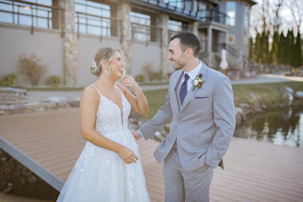 Emily and Frank Rock Island Lake Club, NJ 
Winter weddings are magical, and Emily and Frank’s November celebration at Rock Island Lake Club in Sparta, NJ, was the perfect example of just how enchanting they can be! Who says winter weddings can’t be fun? Despite the chilly weather, their special day was filled with warmth, laughter, and love—a true testament to their joyful spirits and the magic of this incredible venue.
Emily and Frank embraced the crisp November air with an outdoor ceremony by the picturesque lake at Rock Island Lake Club. The serene water, framed by the natural beauty of the surrounding landscape, created an unforgettable backdrop for their vows. Guests bundled up in cozy wraps and blankets, their smiles radiating as they witnessed the couple’s heartfelt promises. The venue’s dedicated team ensured every detail was perfectly executed, making the ceremony seamless.
After the ceremony, the celebration continued with one of the best cocktail hours in all of New Jersey. Rock Island Lake Club is renowned for its exceptional cuisine and creative presentation, and this event was no exception. Guests enjoyed an array of delicious hors d’oeuvres and drinks while mingling in the warm and inviting indoor spaces, thoughtfully designed to complement the venue’s lakeside charm.
The reception was a lively affair, with the dance floor packed from the first song to the last. Friends and family came together to celebrate Emily and Frank’s love, creating an atmosphere of pure joy. The stunning reception room at Rock Island Lake Club, with its elegant décor and large windows overlooking the lake, provided the perfect setting for a night of dancing, laughter, and unforgettable memories.
Rock Island Lake Club truly excels at hosting weddings year-round, but winter weddings here have a special kind of magic. From the attentive staff to the breathtaking views, every aspect of this venue enhances the celebration. Emily and Frank’s wedding day is proof that even on the coldest days, love and happiness can shine brighter than ever.
If you’re considering a winter wedding, Rock Island Lake Club is the perfect venue to bring your vision to life. Emily and Frank’s celebration was a testament to the beauty of the season and the power of love to warm even the chilliest of days.
Emily and Frank Rock Island Lake Club NJ Wedding photographed by Steve from Pearl Paper Studio. Pearl Paper Studio is here to capture real emotions, fun couples with non-traditional wedding stories, now we are booking small intimate backyard wedding, outdoor tent wedding, farm wedding, elopements, nyc elopements. We are currently booking 2025 and 2026 weddings in NJ, Manhattan, Hudson Valley NY, Brooklyn and Long Island.
