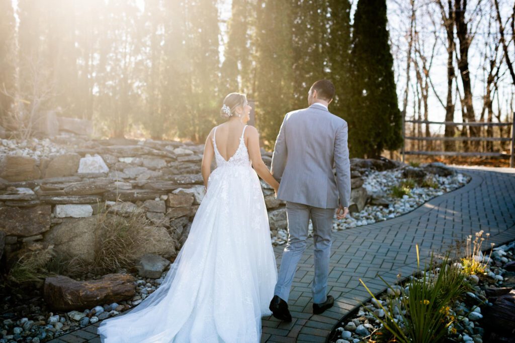 Emily and Frank Rock Island Lake Club, NJ 
Winter weddings are magical, and Emily and Frank’s November celebration at Rock Island Lake Club in Sparta, NJ, was the perfect example of just how enchanting they can be! Who says winter weddings can’t be fun? Despite the chilly weather, their special day was filled with warmth, laughter, and love—a true testament to their joyful spirits and the magic of this incredible venue.
Emily and Frank embraced the crisp November air with an outdoor ceremony by the picturesque lake at Rock Island Lake Club. The serene water, framed by the natural beauty of the surrounding landscape, created an unforgettable backdrop for their vows. Guests bundled up in cozy wraps and blankets, their smiles radiating as they witnessed the couple’s heartfelt promises. The venue’s dedicated team ensured every detail was perfectly executed, making the ceremony seamless.
After the ceremony, the celebration continued with one of the best cocktail hours in all of New Jersey. Rock Island Lake Club is renowned for its exceptional cuisine and creative presentation, and this event was no exception. Guests enjoyed an array of delicious hors d’oeuvres and drinks while mingling in the warm and inviting indoor spaces, thoughtfully designed to complement the venue’s lakeside charm.
The reception was a lively affair, with the dance floor packed from the first song to the last. Friends and family came together to celebrate Emily and Frank’s love, creating an atmosphere of pure joy. The stunning reception room at Rock Island Lake Club, with its elegant décor and large windows overlooking the lake, provided the perfect setting for a night of dancing, laughter, and unforgettable memories.
Rock Island Lake Club truly excels at hosting weddings year-round, but winter weddings here have a special kind of magic. From the attentive staff to the breathtaking views, every aspect of this venue enhances the celebration. Emily and Frank’s wedding day is proof that even on the coldest days, love and happiness can shine brighter than ever.
If you’re considering a winter wedding, Rock Island Lake Club is the perfect venue to bring your vision to life. Emily and Frank’s celebration was a testament to the beauty of the season and the power of love to warm even the chilliest of days.
Emily and Frank Rock Island Lake Club NJ Wedding photographed by Steve from Pearl Paper Studio. Pearl Paper Studio is here to capture real emotions, fun couples with non-traditional wedding stories, now we are booking small intimate backyard wedding, outdoor tent wedding, farm wedding, elopements, nyc elopements. We are currently booking 2025 and 2026 weddings in NJ, Manhattan, Hudson Valley NY, Brooklyn and Long Island.
