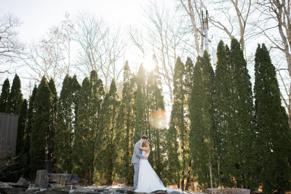 Emily and Frank Rock Island Lake Club, NJ 
Winter weddings are magical, and Emily and Frank’s November celebration at Rock Island Lake Club in Sparta, NJ, was the perfect example of just how enchanting they can be! Who says winter weddings can’t be fun? Despite the chilly weather, their special day was filled with warmth, laughter, and love—a true testament to their joyful spirits and the magic of this incredible venue.
Emily and Frank embraced the crisp November air with an outdoor ceremony by the picturesque lake at Rock Island Lake Club. The serene water, framed by the natural beauty of the surrounding landscape, created an unforgettable backdrop for their vows. Guests bundled up in cozy wraps and blankets, their smiles radiating as they witnessed the couple’s heartfelt promises. The venue’s dedicated team ensured every detail was perfectly executed, making the ceremony seamless.
After the ceremony, the celebration continued with one of the best cocktail hours in all of New Jersey. Rock Island Lake Club is renowned for its exceptional cuisine and creative presentation, and this event was no exception. Guests enjoyed an array of delicious hors d’oeuvres and drinks while mingling in the warm and inviting indoor spaces, thoughtfully designed to complement the venue’s lakeside charm.
The reception was a lively affair, with the dance floor packed from the first song to the last. Friends and family came together to celebrate Emily and Frank’s love, creating an atmosphere of pure joy. The stunning reception room at Rock Island Lake Club, with its elegant décor and large windows overlooking the lake, provided the perfect setting for a night of dancing, laughter, and unforgettable memories.
Rock Island Lake Club truly excels at hosting weddings year-round, but winter weddings here have a special kind of magic. From the attentive staff to the breathtaking views, every aspect of this venue enhances the celebration. Emily and Frank’s wedding day is proof that even on the coldest days, love and happiness can shine brighter than ever.
If you’re considering a winter wedding, Rock Island Lake Club is the perfect venue to bring your vision to life. Emily and Frank’s celebration was a testament to the beauty of the season and the power of love to warm even the chilliest of days.
Emily and Frank Rock Island Lake Club NJ Wedding photographed by Steve from Pearl Paper Studio. Pearl Paper Studio is here to capture real emotions, fun couples with non-traditional wedding stories, now we are booking small intimate backyard wedding, outdoor tent wedding, farm wedding, elopements, nyc elopements. We are currently booking 2025 and 2026 weddings in NJ, Manhattan, Hudson Valley NY, Brooklyn and Long Island.
