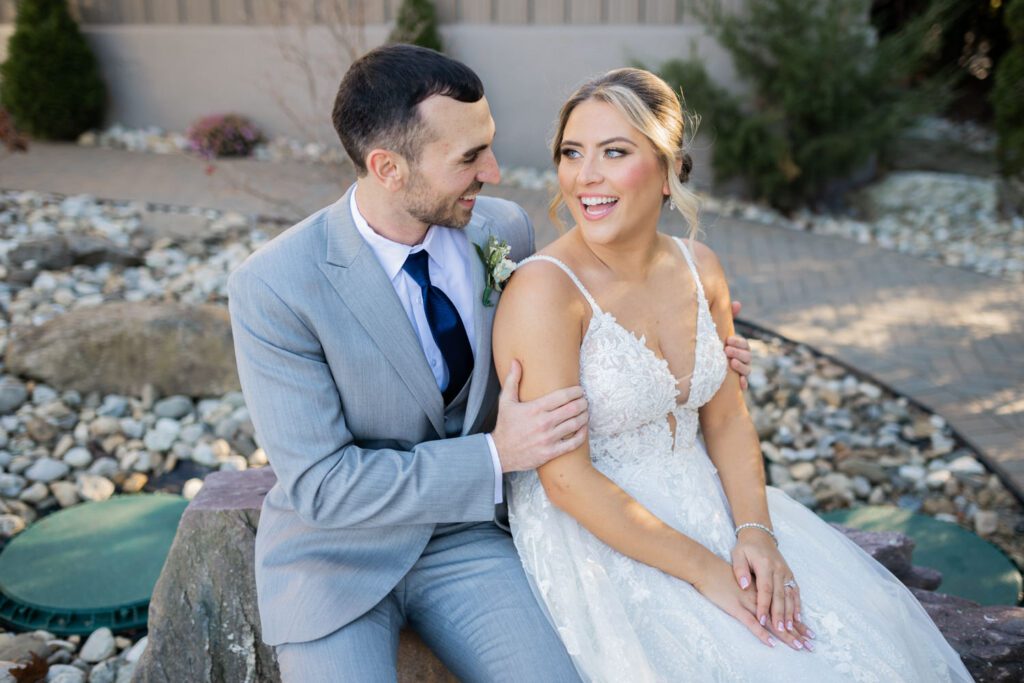 Emily and Frank Rock Island Lake Club, NJ 
Winter weddings are magical, and Emily and Frank’s November celebration at Rock Island Lake Club in Sparta, NJ, was the perfect example of just how enchanting they can be! Who says winter weddings can’t be fun? Despite the chilly weather, their special day was filled with warmth, laughter, and love—a true testament to their joyful spirits and the magic of this incredible venue.
Emily and Frank embraced the crisp November air with an outdoor ceremony by the picturesque lake at Rock Island Lake Club. The serene water, framed by the natural beauty of the surrounding landscape, created an unforgettable backdrop for their vows. Guests bundled up in cozy wraps and blankets, their smiles radiating as they witnessed the couple’s heartfelt promises. The venue’s dedicated team ensured every detail was perfectly executed, making the ceremony seamless.
After the ceremony, the celebration continued with one of the best cocktail hours in all of New Jersey. Rock Island Lake Club is renowned for its exceptional cuisine and creative presentation, and this event was no exception. Guests enjoyed an array of delicious hors d’oeuvres and drinks while mingling in the warm and inviting indoor spaces, thoughtfully designed to complement the venue’s lakeside charm.
The reception was a lively affair, with the dance floor packed from the first song to the last. Friends and family came together to celebrate Emily and Frank’s love, creating an atmosphere of pure joy. The stunning reception room at Rock Island Lake Club, with its elegant décor and large windows overlooking the lake, provided the perfect setting for a night of dancing, laughter, and unforgettable memories.
Rock Island Lake Club truly excels at hosting weddings year-round, but winter weddings here have a special kind of magic. From the attentive staff to the breathtaking views, every aspect of this venue enhances the celebration. Emily and Frank’s wedding day is proof that even on the coldest days, love and happiness can shine brighter than ever.
If you’re considering a winter wedding, Rock Island Lake Club is the perfect venue to bring your vision to life. Emily and Frank’s celebration was a testament to the beauty of the season and the power of love to warm even the chilliest of days.
Emily and Frank Rock Island Lake Club NJ Wedding photographed by Steve from Pearl Paper Studio. Pearl Paper Studio is here to capture real emotions, fun couples with non-traditional wedding stories, now we are booking small intimate backyard wedding, outdoor tent wedding, farm wedding, elopements, nyc elopements. We are currently booking 2025 and 2026 weddings in NJ, Manhattan, Hudson Valley NY, Brooklyn and Long Island.
