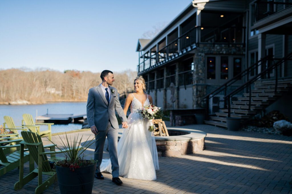 Emily and Frank Rock Island Lake Club, NJ 
Winter weddings are magical, and Emily and Frank’s November celebration at Rock Island Lake Club in Sparta, NJ, was the perfect example of just how enchanting they can be! Who says winter weddings can’t be fun? Despite the chilly weather, their special day was filled with warmth, laughter, and love—a true testament to their joyful spirits and the magic of this incredible venue.
Emily and Frank embraced the crisp November air with an outdoor ceremony by the picturesque lake at Rock Island Lake Club. The serene water, framed by the natural beauty of the surrounding landscape, created an unforgettable backdrop for their vows. Guests bundled up in cozy wraps and blankets, their smiles radiating as they witnessed the couple’s heartfelt promises. The venue’s dedicated team ensured every detail was perfectly executed, making the ceremony seamless.
After the ceremony, the celebration continued with one of the best cocktail hours in all of New Jersey. Rock Island Lake Club is renowned for its exceptional cuisine and creative presentation, and this event was no exception. Guests enjoyed an array of delicious hors d’oeuvres and drinks while mingling in the warm and inviting indoor spaces, thoughtfully designed to complement the venue’s lakeside charm.
The reception was a lively affair, with the dance floor packed from the first song to the last. Friends and family came together to celebrate Emily and Frank’s love, creating an atmosphere of pure joy. The stunning reception room at Rock Island Lake Club, with its elegant décor and large windows overlooking the lake, provided the perfect setting for a night of dancing, laughter, and unforgettable memories.
Rock Island Lake Club truly excels at hosting weddings year-round, but winter weddings here have a special kind of magic. From the attentive staff to the breathtaking views, every aspect of this venue enhances the celebration. Emily and Frank’s wedding day is proof that even on the coldest days, love and happiness can shine brighter than ever.
If you’re considering a winter wedding, Rock Island Lake Club is the perfect venue to bring your vision to life. Emily and Frank’s celebration was a testament to the beauty of the season and the power of love to warm even the chilliest of days.
Emily and Frank Rock Island Lake Club NJ Wedding photographed by Steve from Pearl Paper Studio. Pearl Paper Studio is here to capture real emotions, fun couples with non-traditional wedding stories, now we are booking small intimate backyard wedding, outdoor tent wedding, farm wedding, elopements, nyc elopements. We are currently booking 2025 and 2026 weddings in NJ, Manhattan, Hudson Valley NY, Brooklyn and Long Island.
