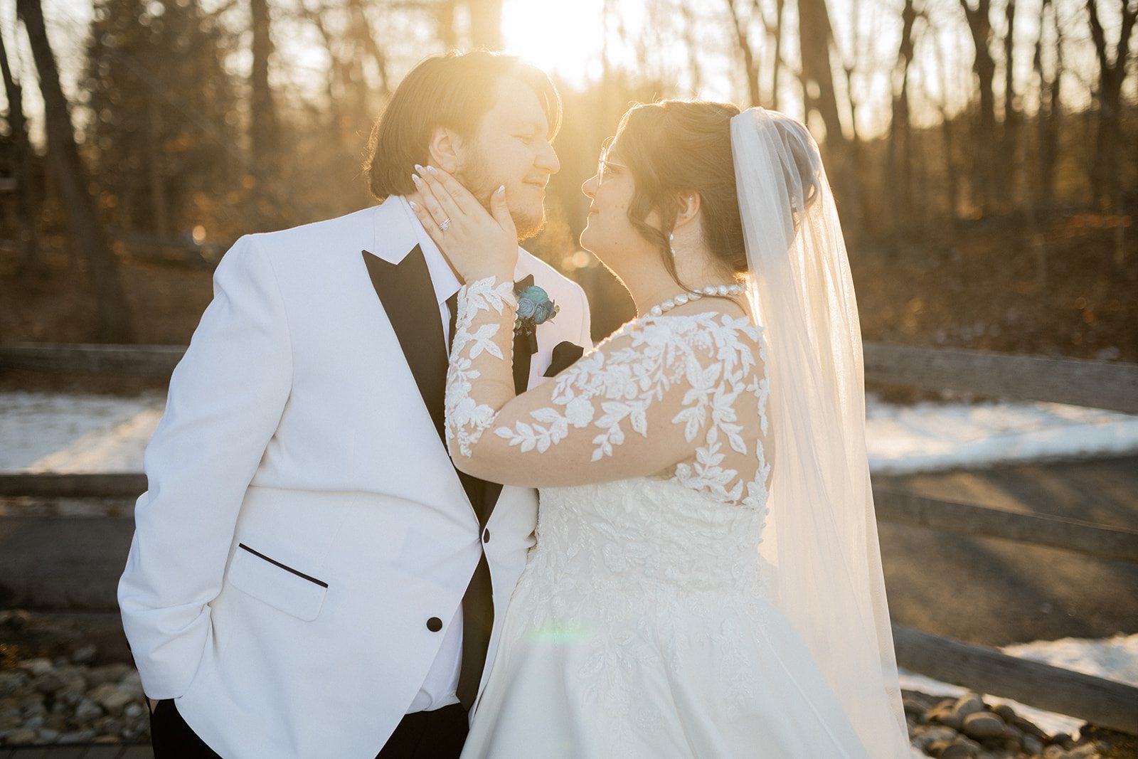 Emily and Sean share a quiet outdoor portrait in winter sunlight.